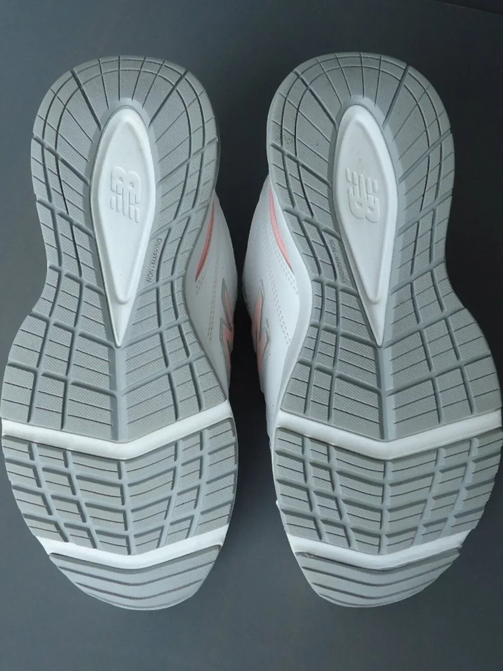 SIZE 9.5. D. New Balance women's white leather sneakers shoes.